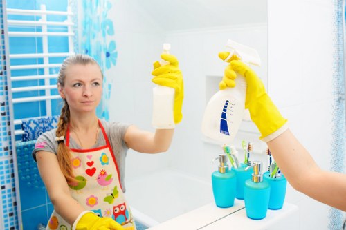 Professional cleaner in Shoreditch servicing a modern urban apartment