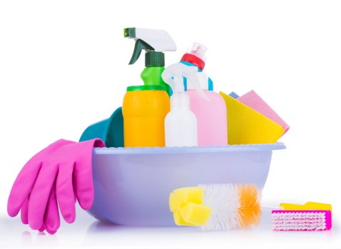 Cleaner preparing an oven cleaning job with safety equipment and organized tools