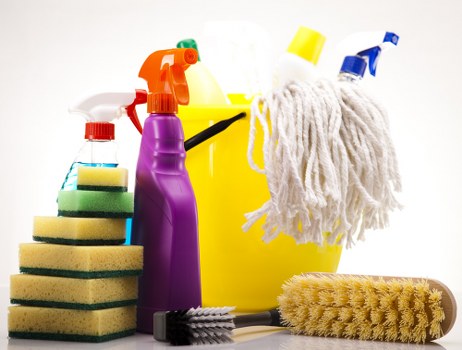 A cleaner using specialist equipment for window cleaning in Shoreditch